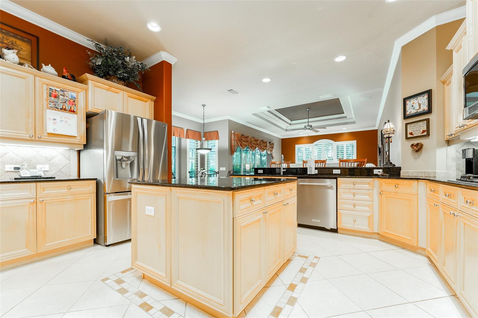 Well Designed Kitchen with Plentiful Wood Cabinets, Stone Counter Tops