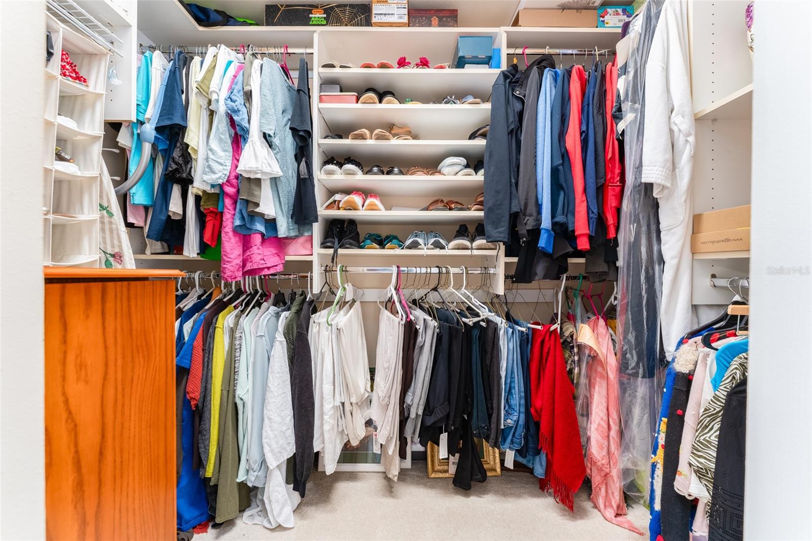 Larger of Two Walk in Closets with Organizers in Primary Suite