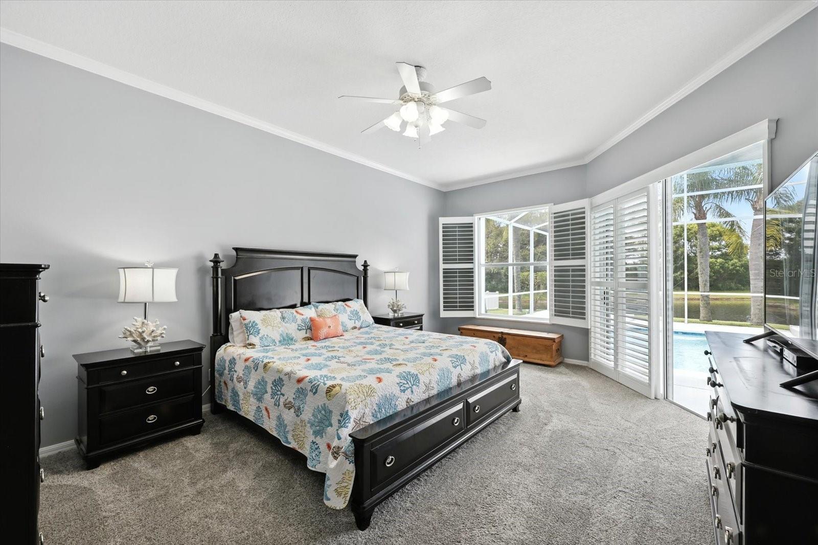 Primary Bedroom with Pool Access and Pond Views
