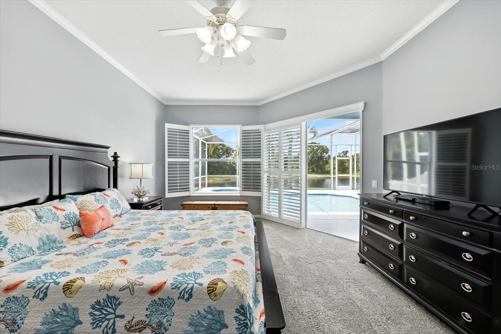 Primary Bedroom with Pool Access and Pond Views