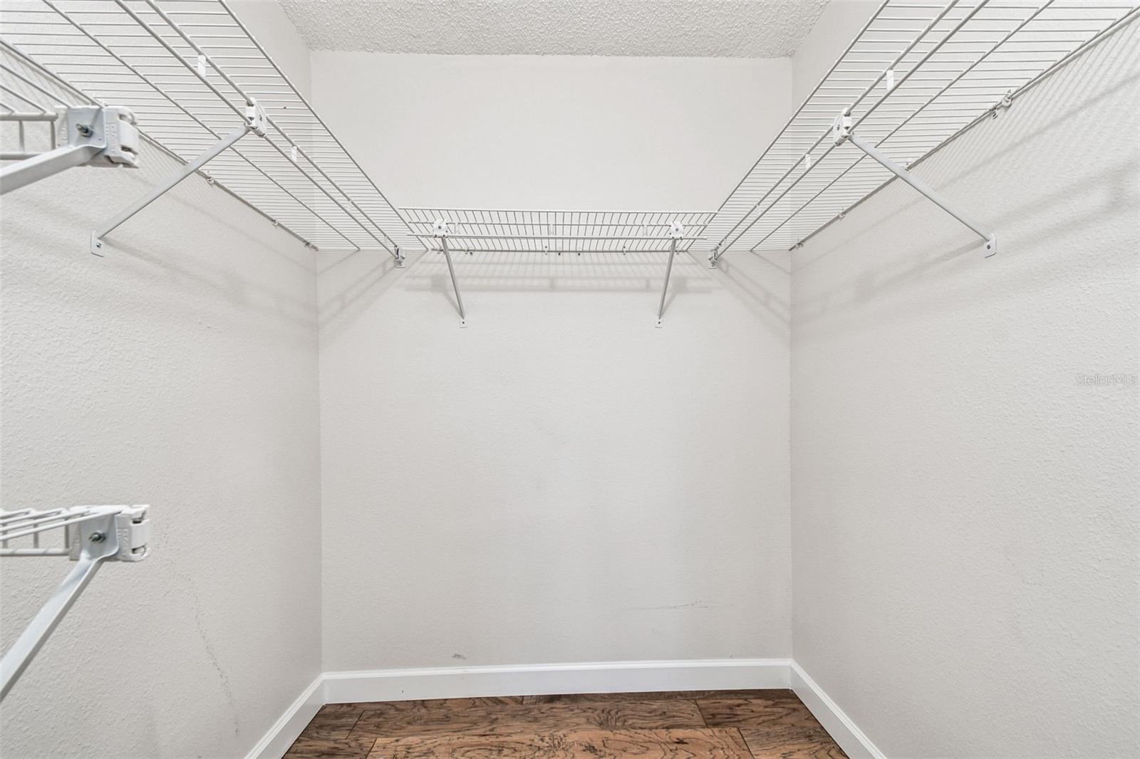 Walk-in closet in primary bedroom