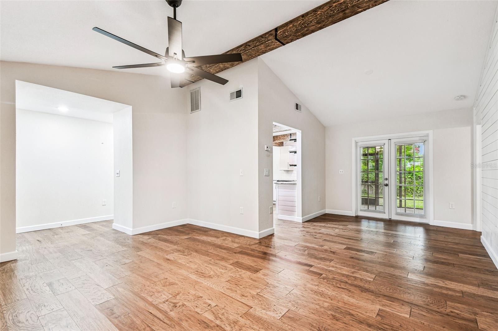 Living room & Dining area with french doors to the backyard
