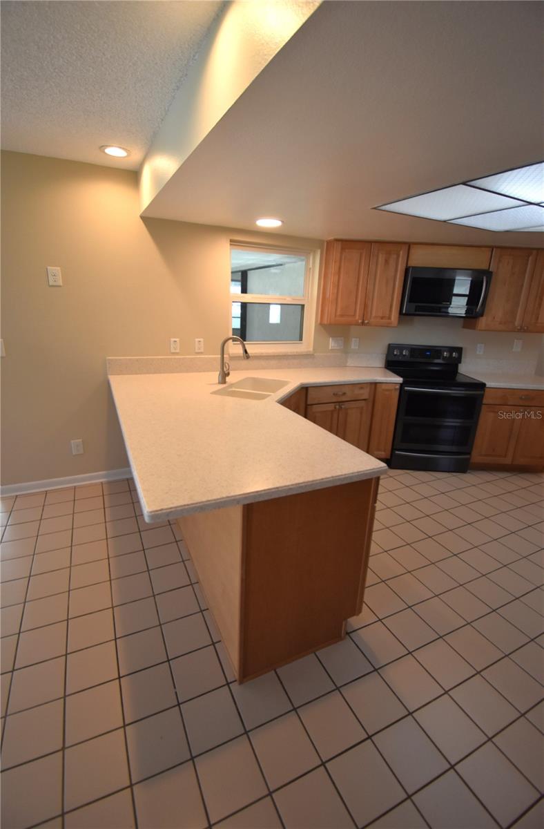 Kitchen with counter-height breakfast bar
