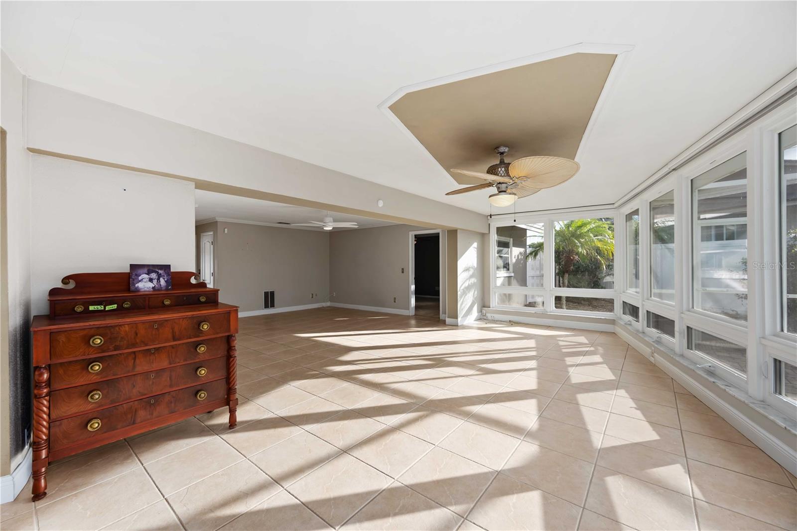 The living area opens up to the dining area, flooded with light!