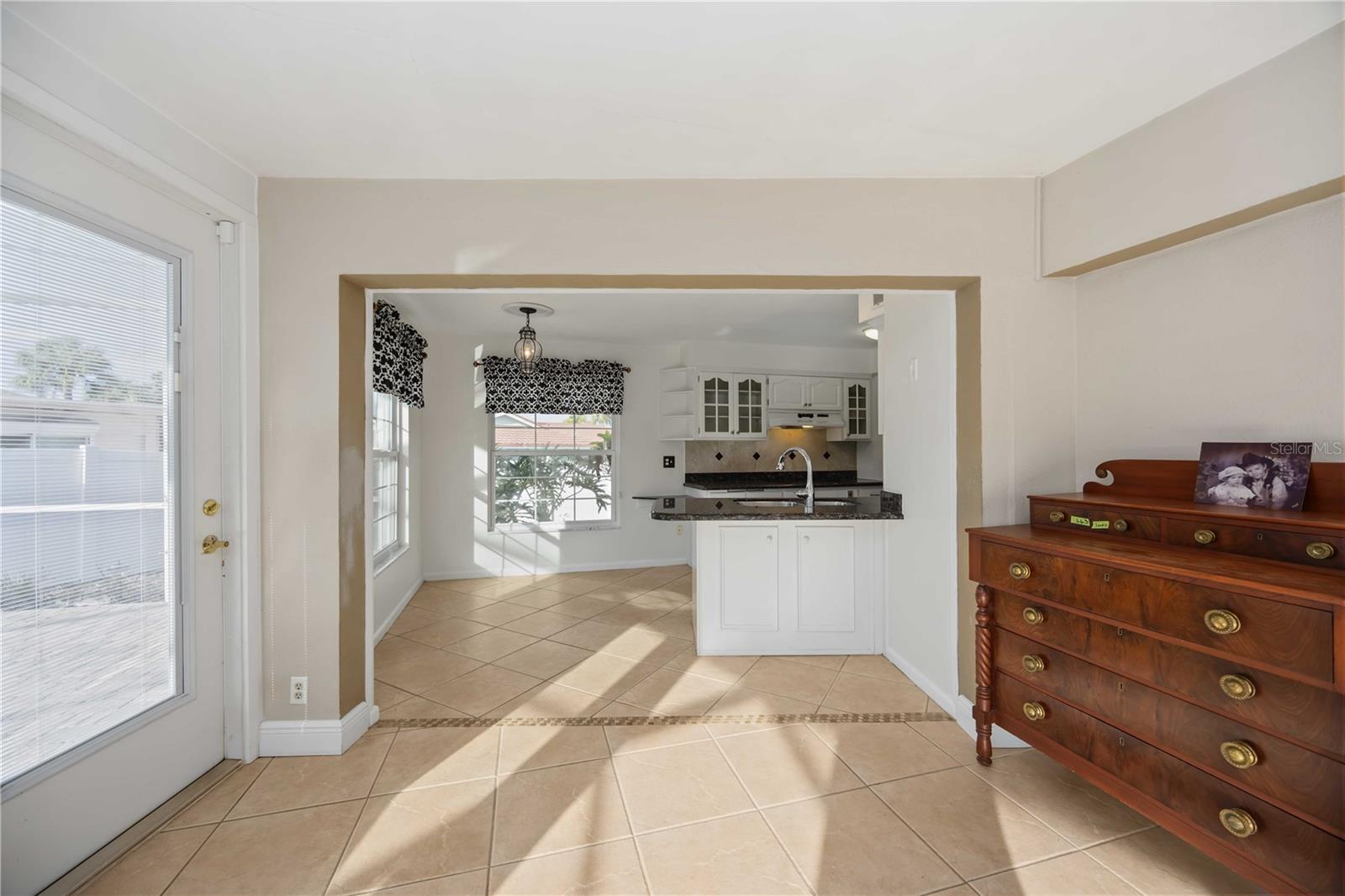 Dining area leads in to the eat-in kitchen.