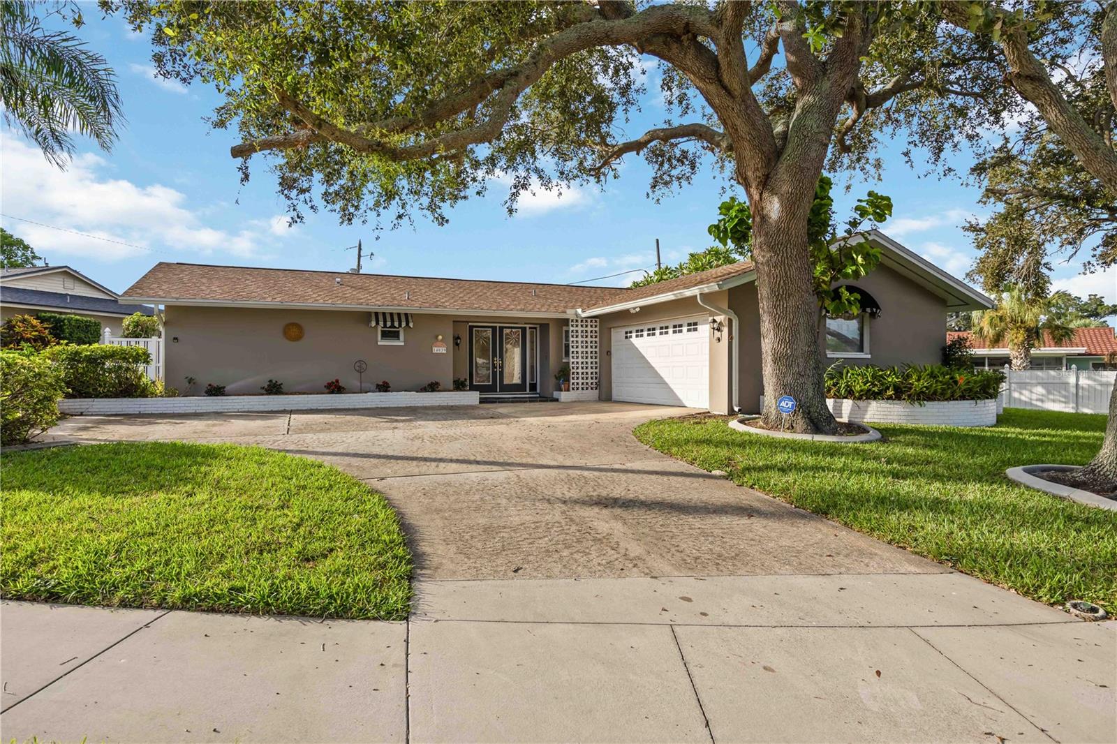 How nice it is to have the 2 car garage on the side of the home! Plenty of parking for guests!
