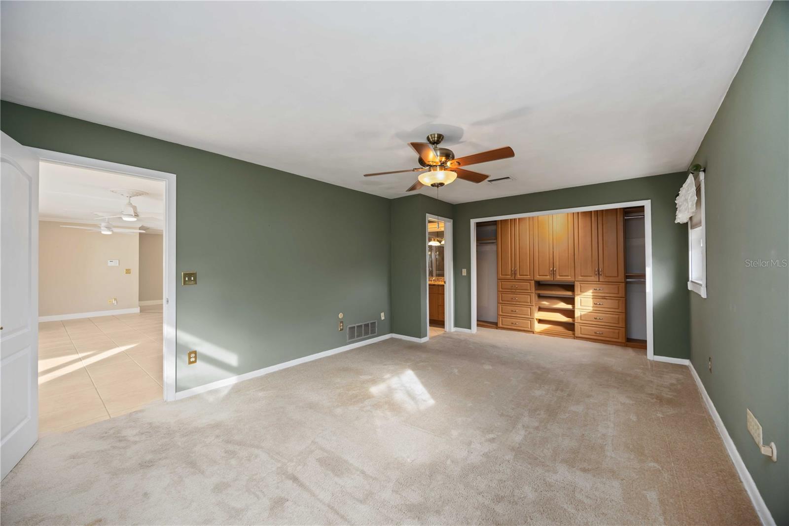 Gorgeous custom cabinetry in the closet area.