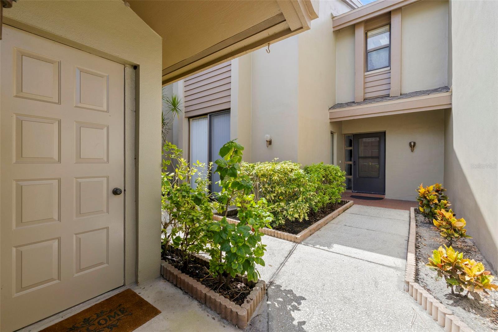 enjoy a front patio courtyard between garage and home
