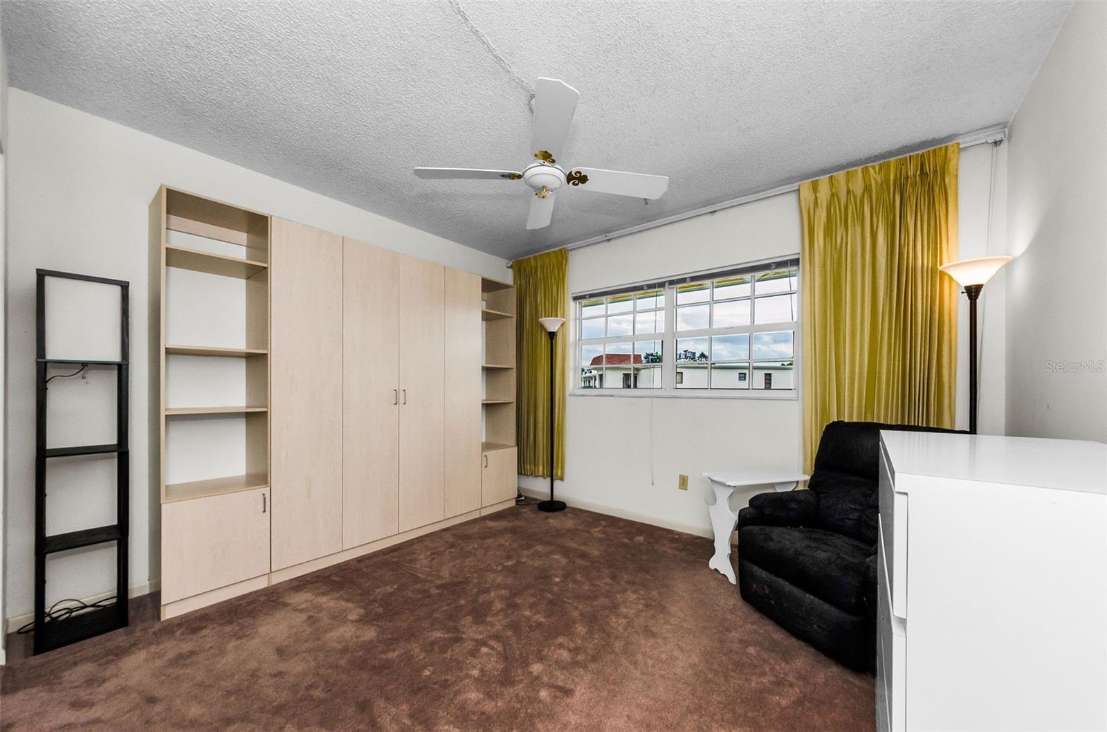 Bedroom with closed Murphy Bed - a great space savings