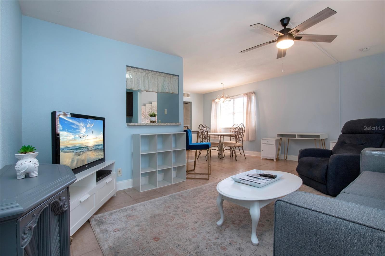 Living room with view of kitchen pass through