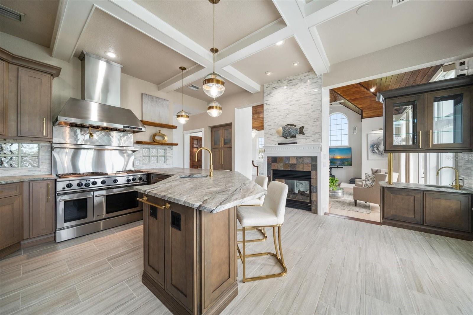 The expertly designed kitchen area transitions seamlessly into the living area and outdoor balcony.