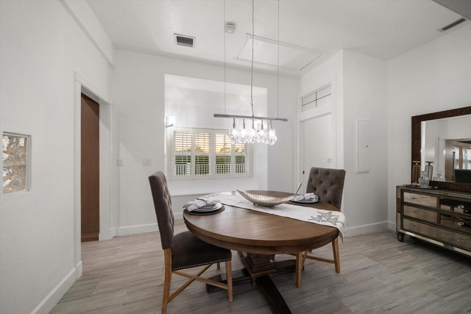 The formal dining off of the kitchen is inviting and private, perfect for intimate gatherings.