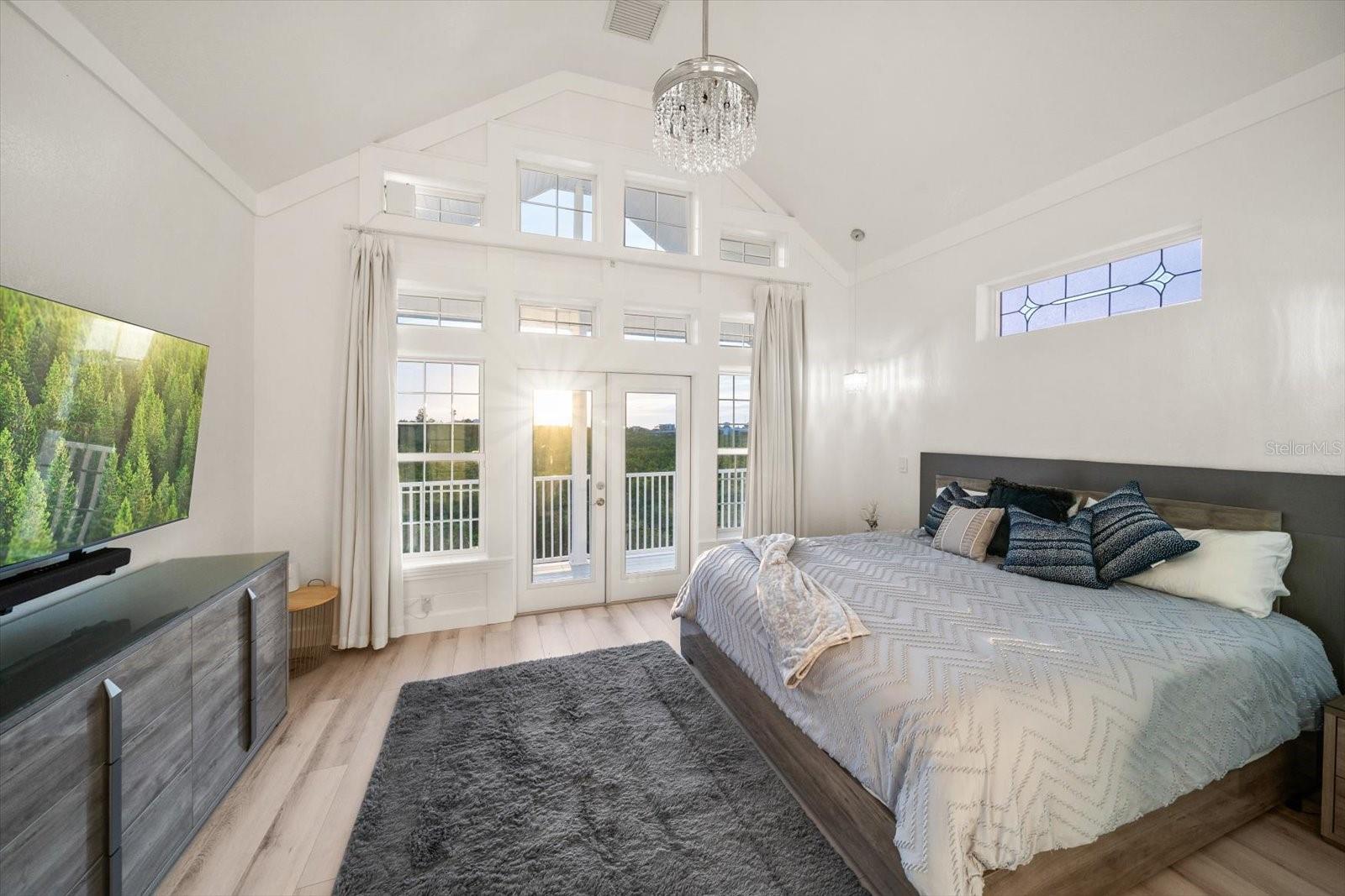 The primary suite located on the third level is perched above the preserve offering sensational vistas of the western horizon.