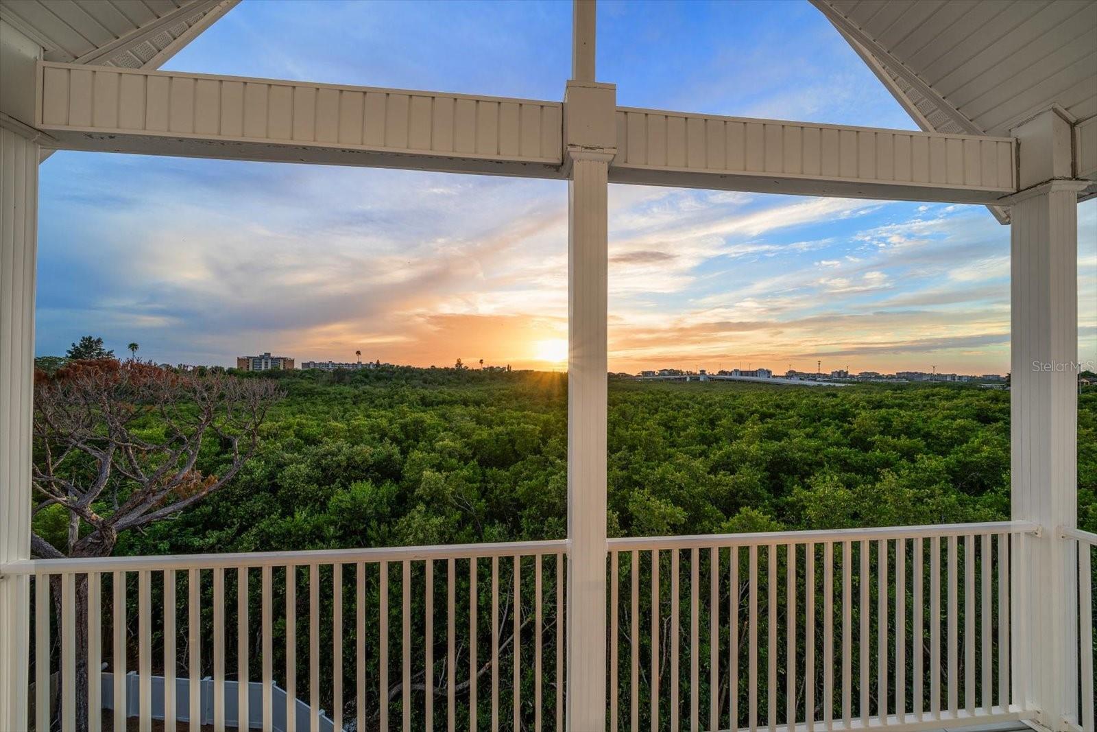 A private balcony is accessed from the primary suite on the third level, a perfect spot to start or end the day.