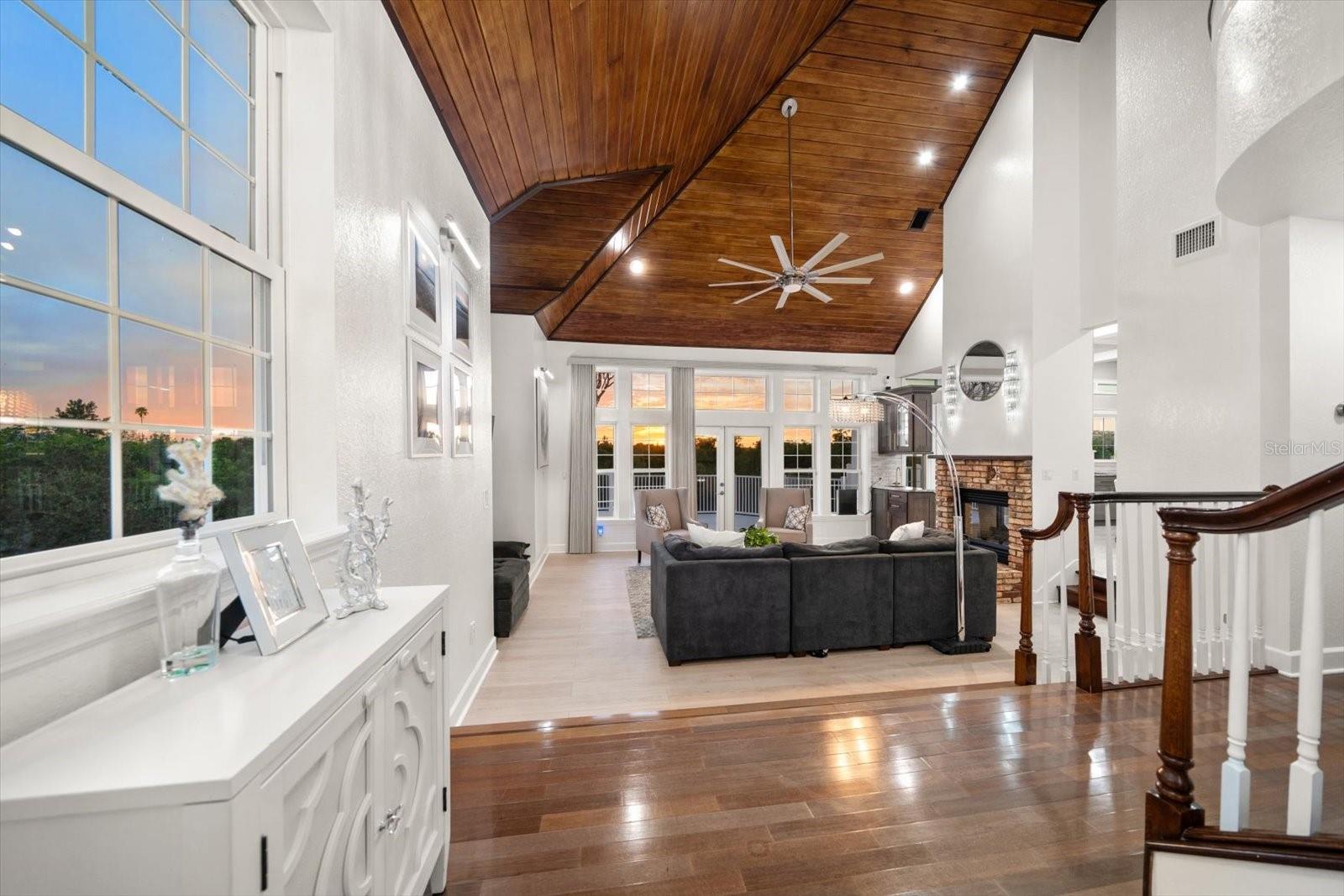 The grand foyer entry leads to the main living area on the second level.