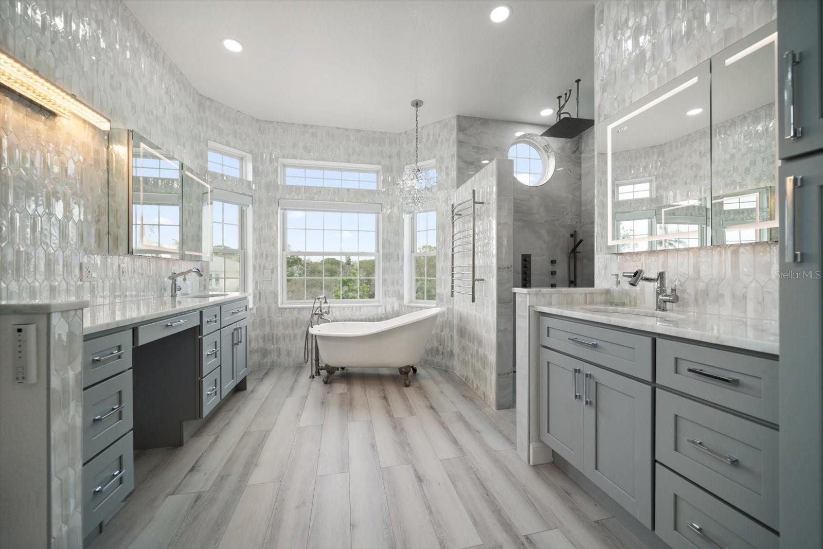Discover true tranquility in this spa-like primary bathroom, remodeled with the highest caliber in mind.