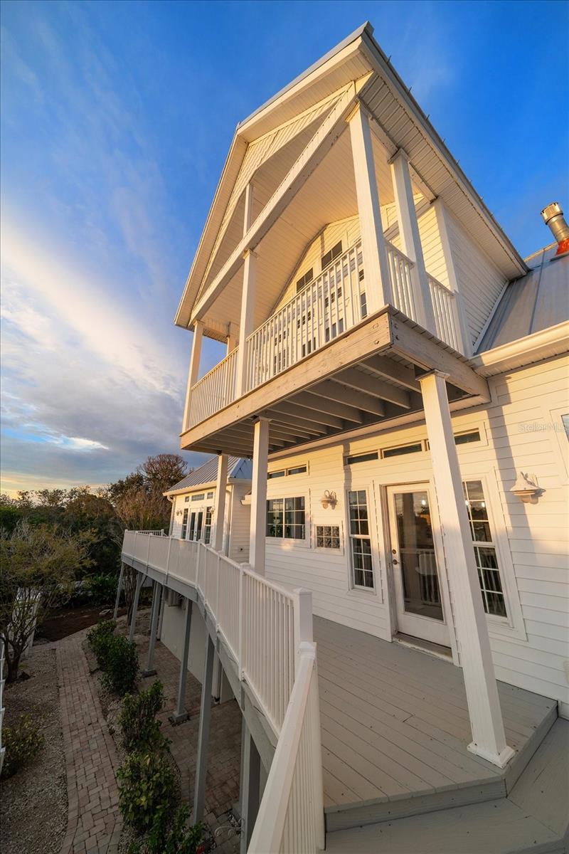 The rear of the property faces west, bathed with sunset rays.