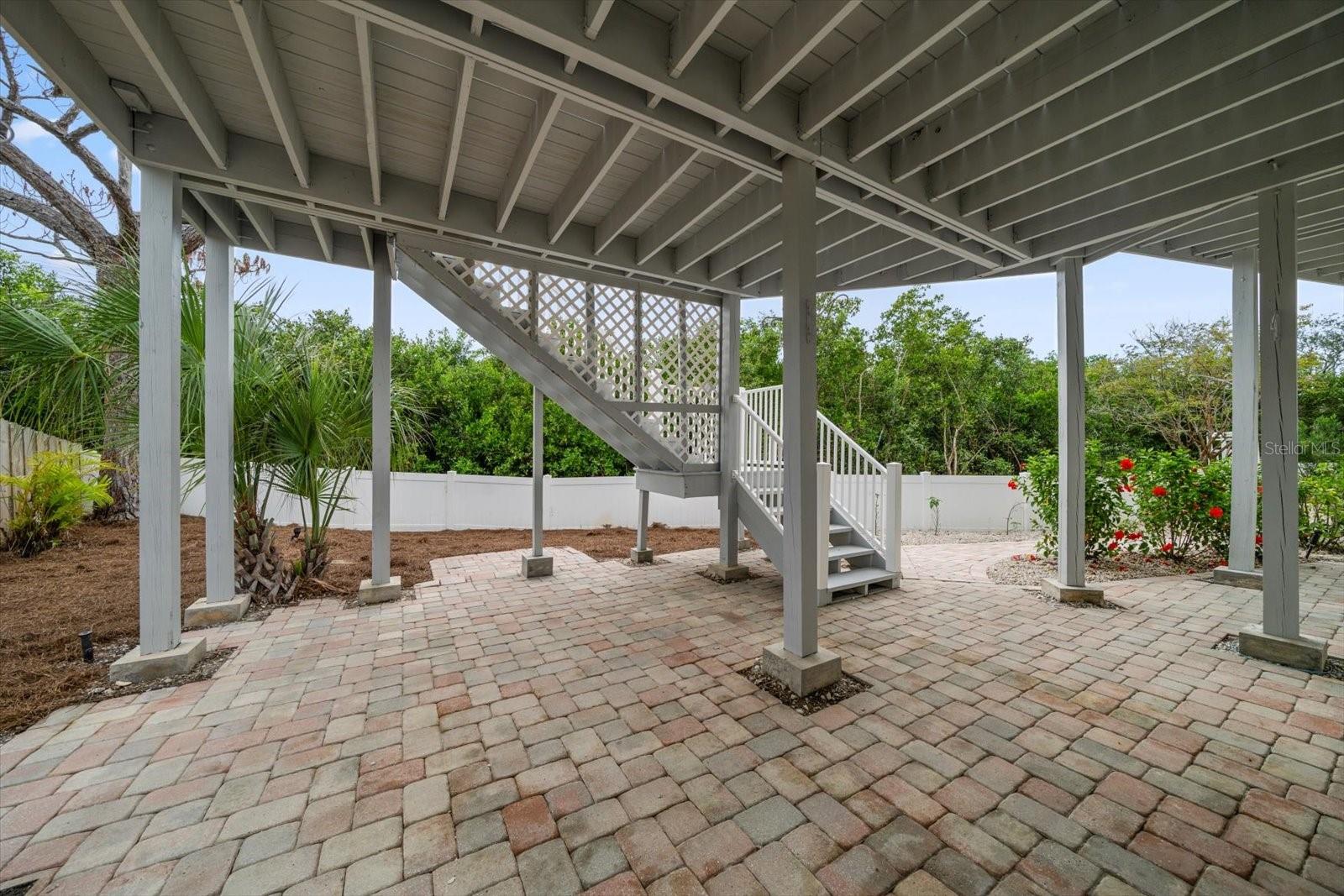 Covered patio on ground level with lots of space to spread out.