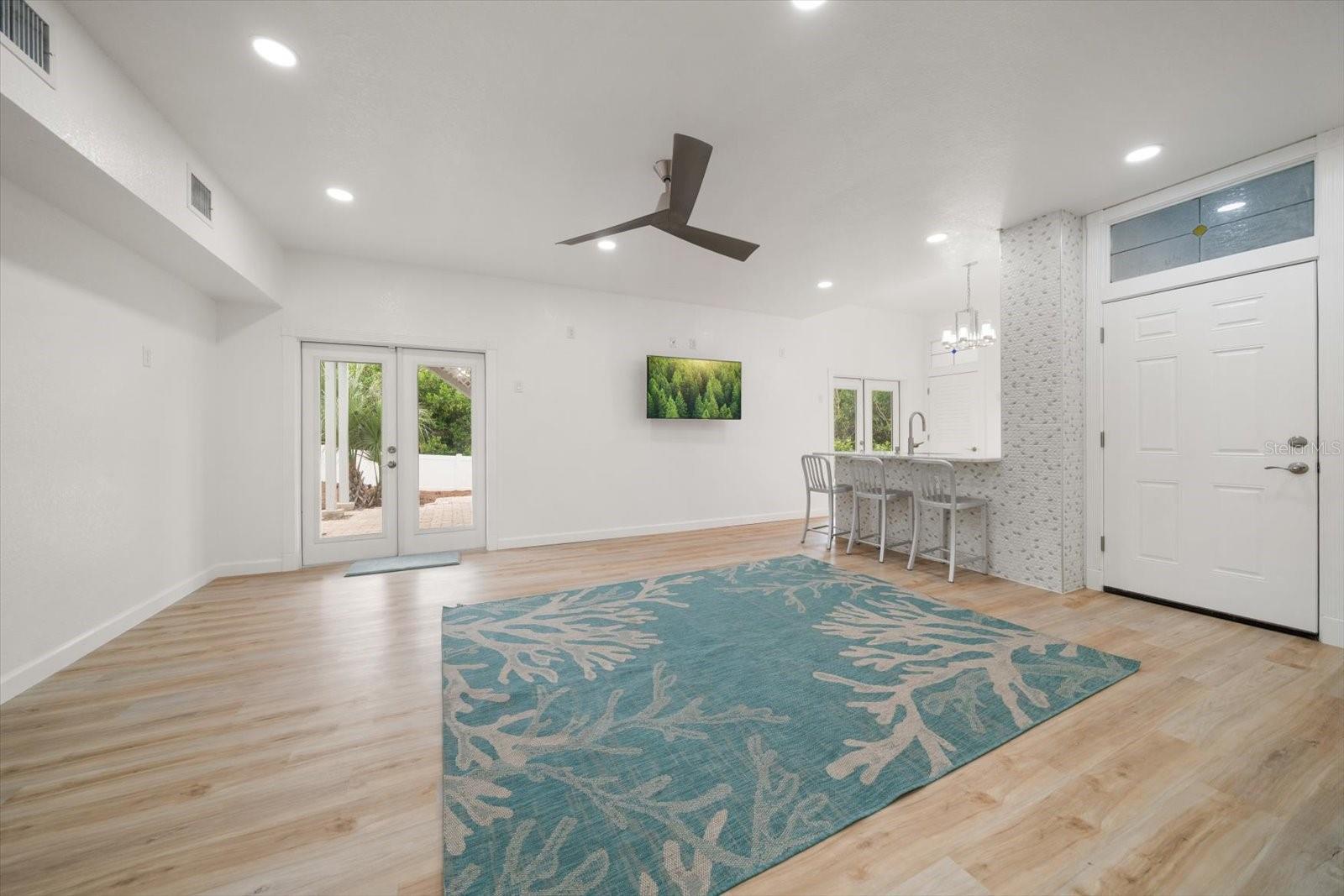 Ground-level flex space, not included in the heated square footage, provides a versatile space to be used as a fitness area, hobby or rec room.