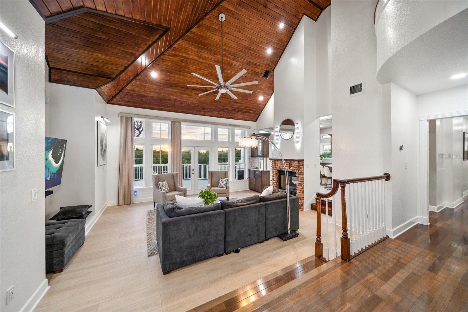 The sunken living area provides optimal relaxation with a coastal design and exceptional views of mangroves perched along the Intracoastal Waterway.