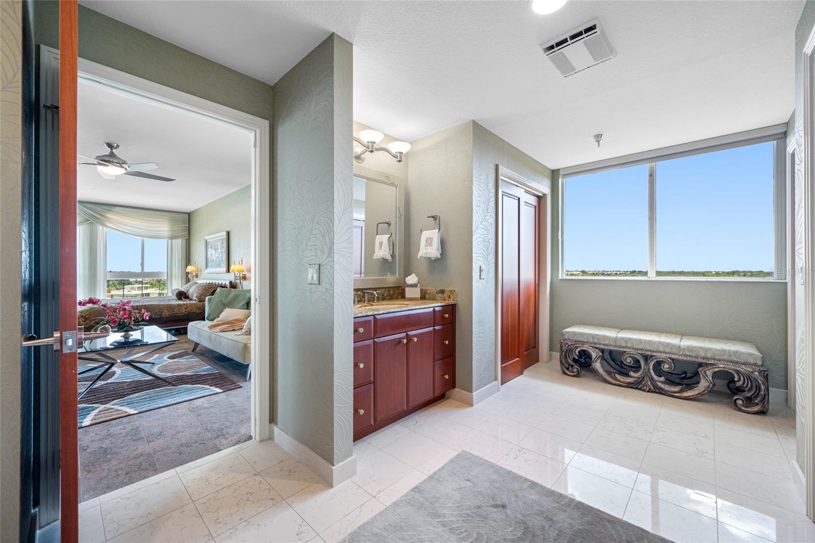 Master bath with 3 closets, 2 vanities, huge shower, water closet and an amazing view