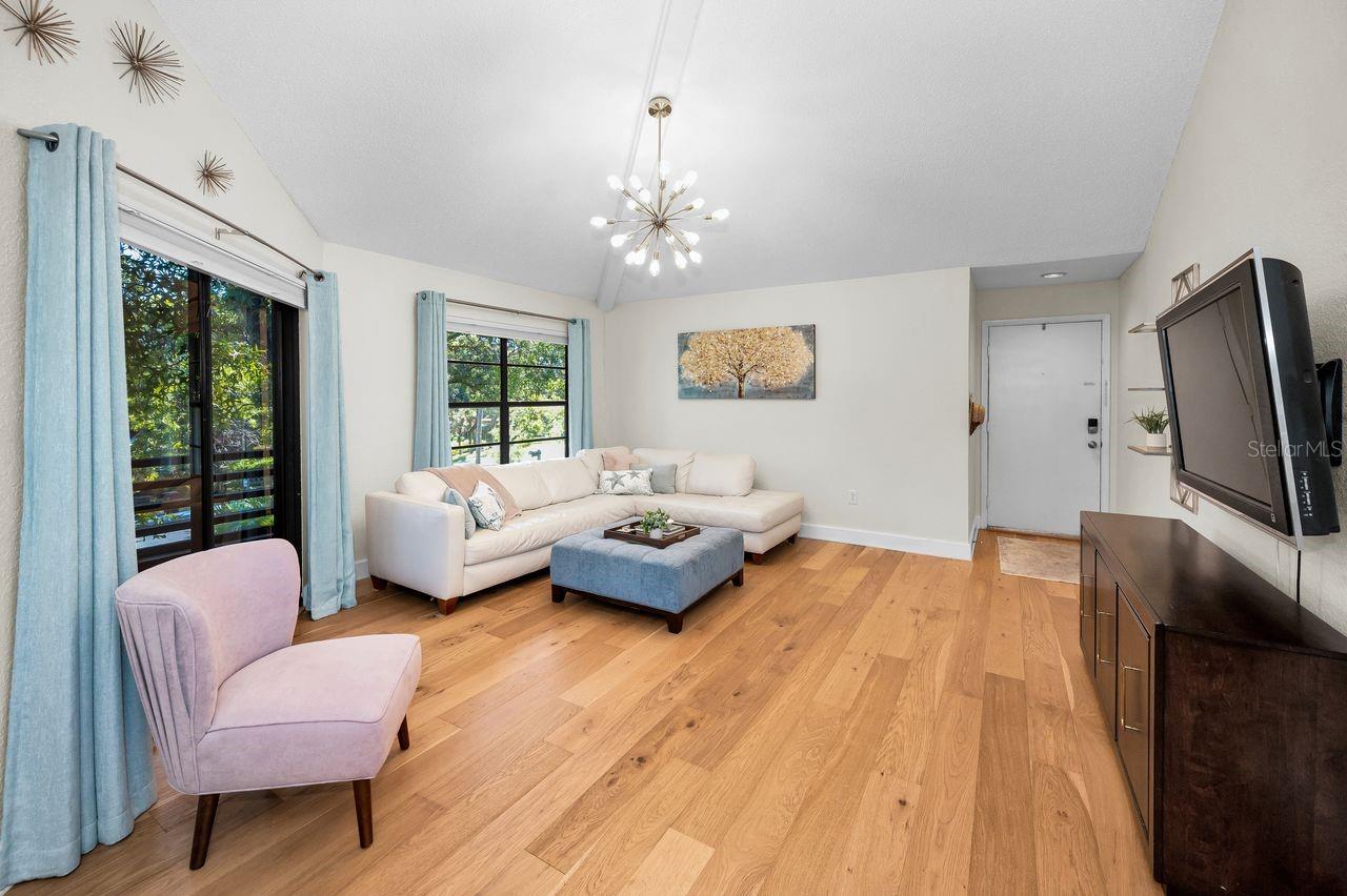 Vaulted ceilings, custom blinds, a screened porch and more!