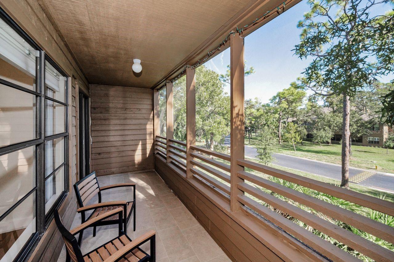 Outdoor living space easily accessed from living room and primary bedroom