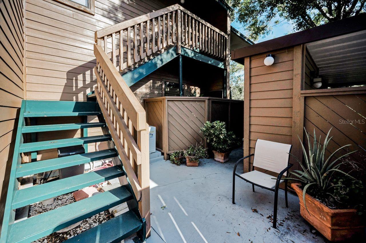 Enjoy your own private courtyard. Hose accessible under stairs for any plants or gardening needs.