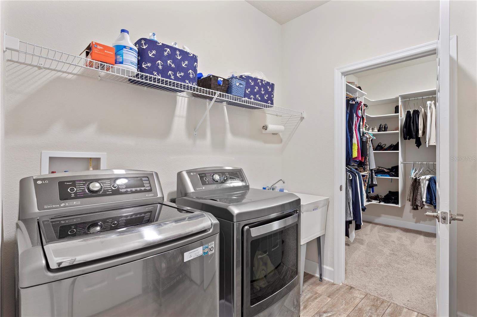Laundry Room with door to Owner closet