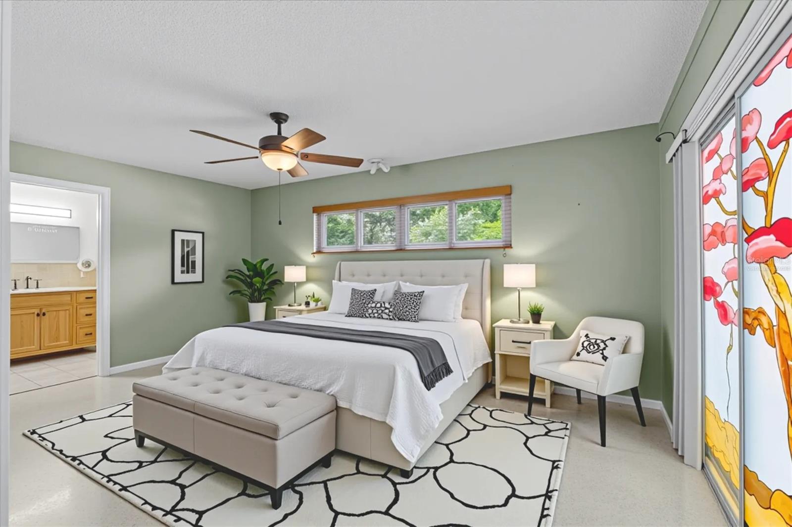 Virtually staged primary bedroom with ensuite bath.
