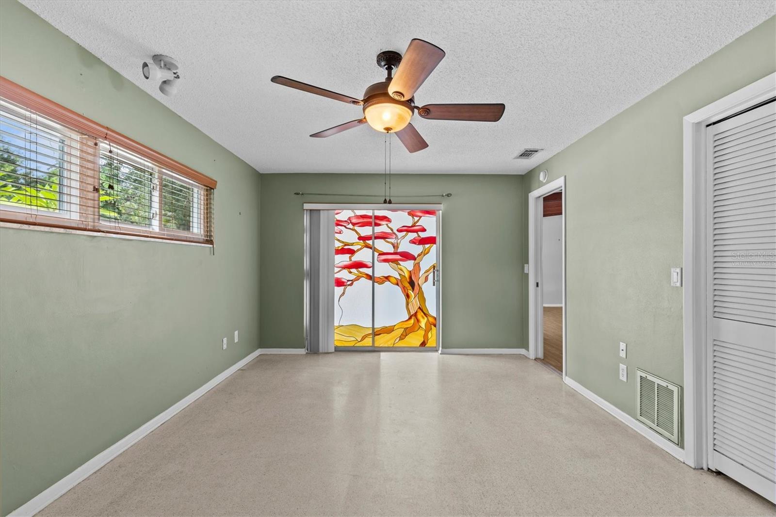 Custom stained glass sliding doors to the lanai.