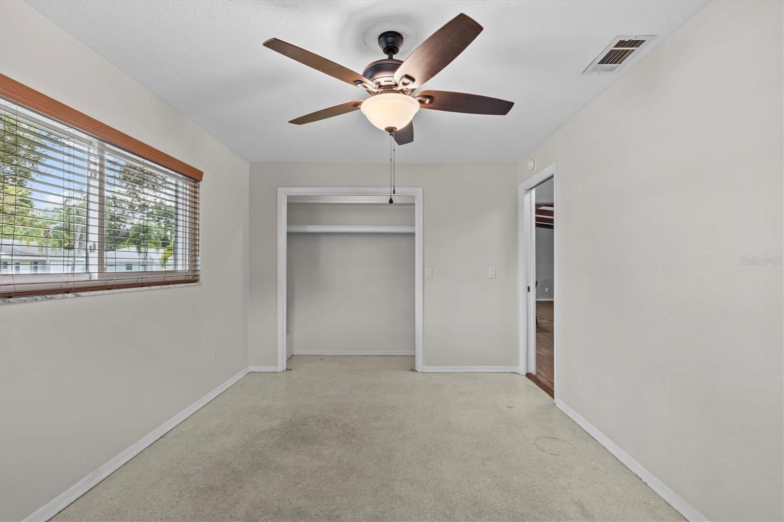 Bedroom 2 built in closet with doors removed.