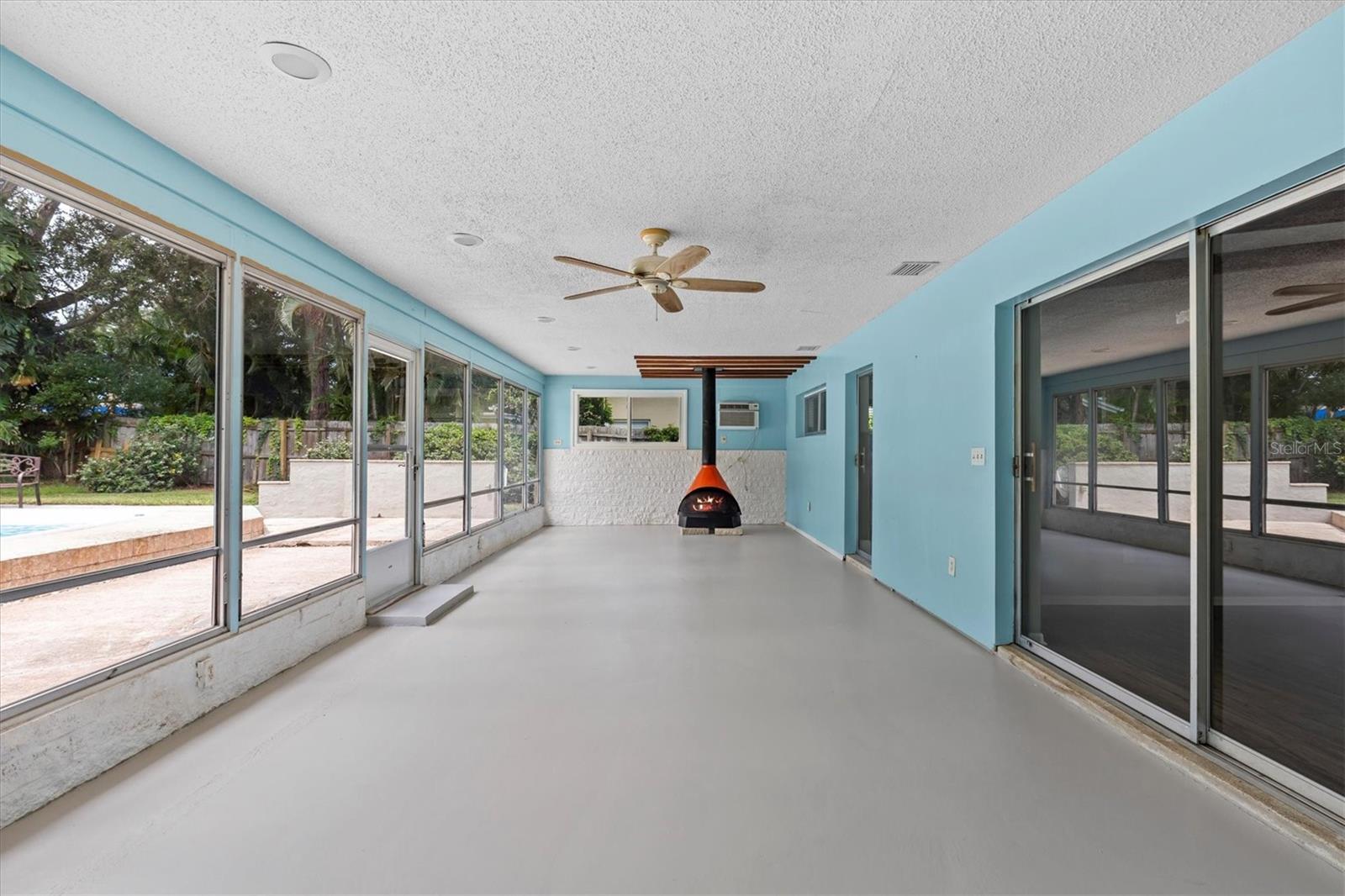 35 x 14 lanai offers opportunity to add 490 SF of additional heated space to home. Cozy free-standing wood burning fireplace.