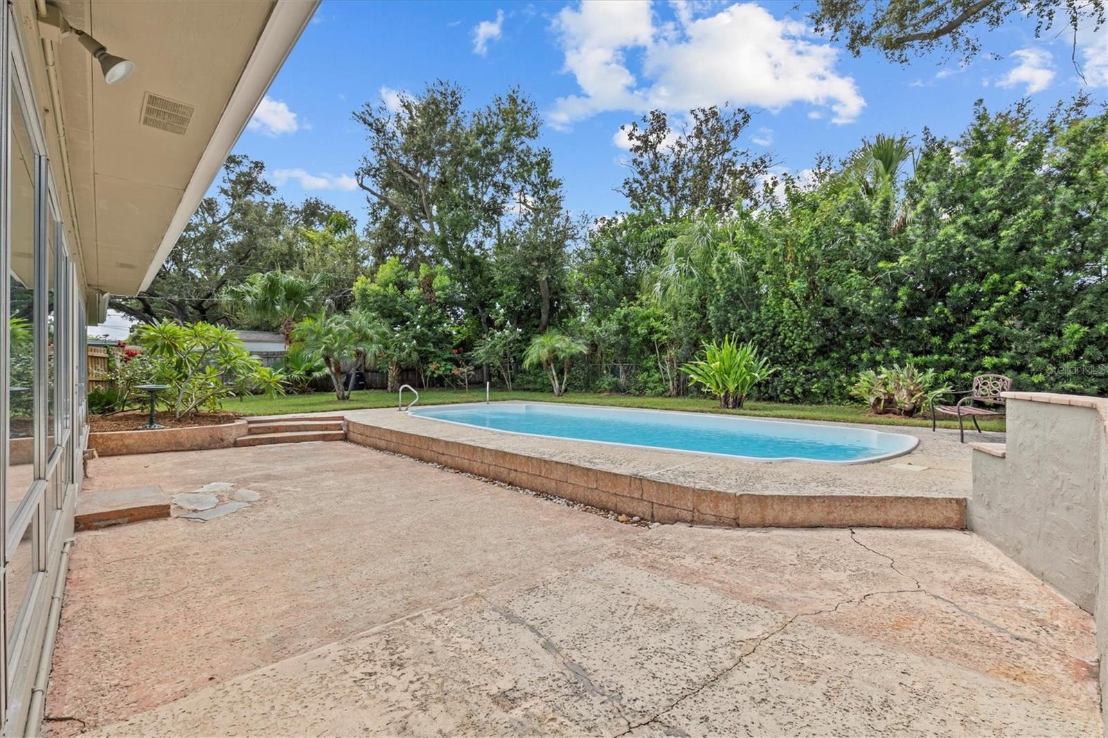 Lots of patio space and landscaping provides privacy all around.