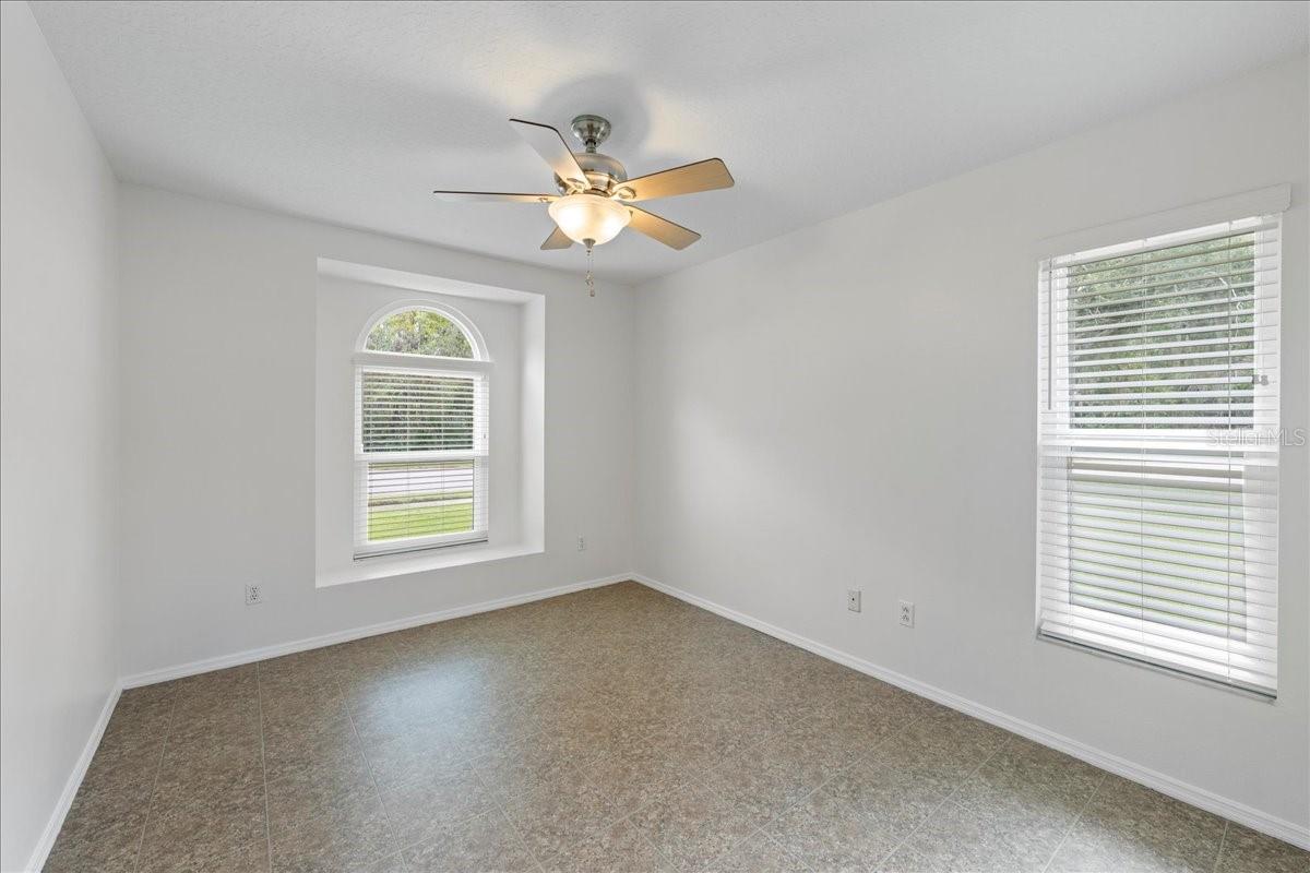 Second bedroom enjoys a recessed window with view out to conservation in front.