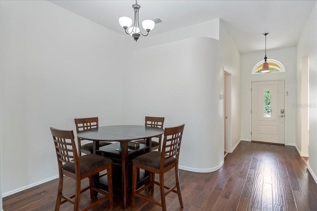 Dining room just off the kitchen flows into the living room.