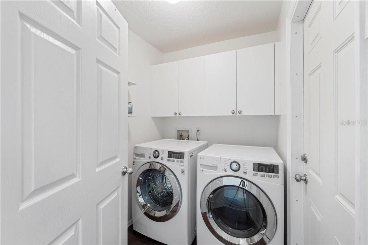 utility room with garage door entry