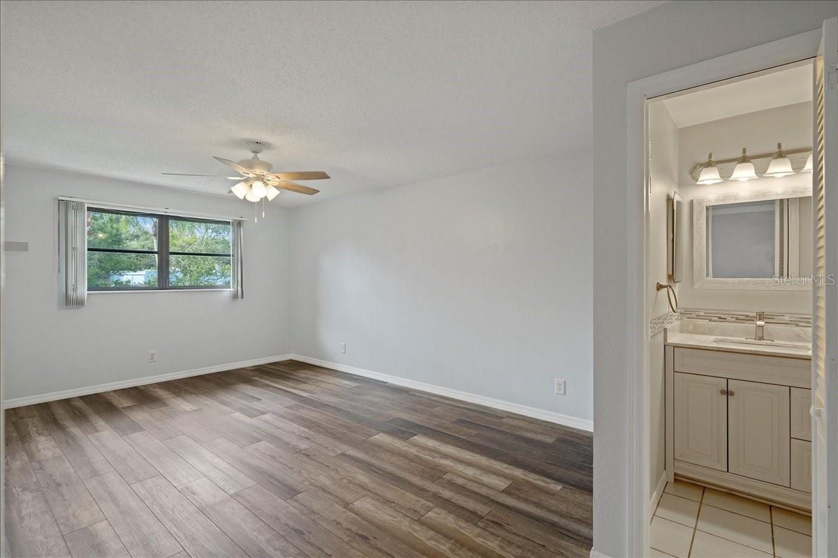 Primary bedroom with ensuite bathroom and walk-in closet