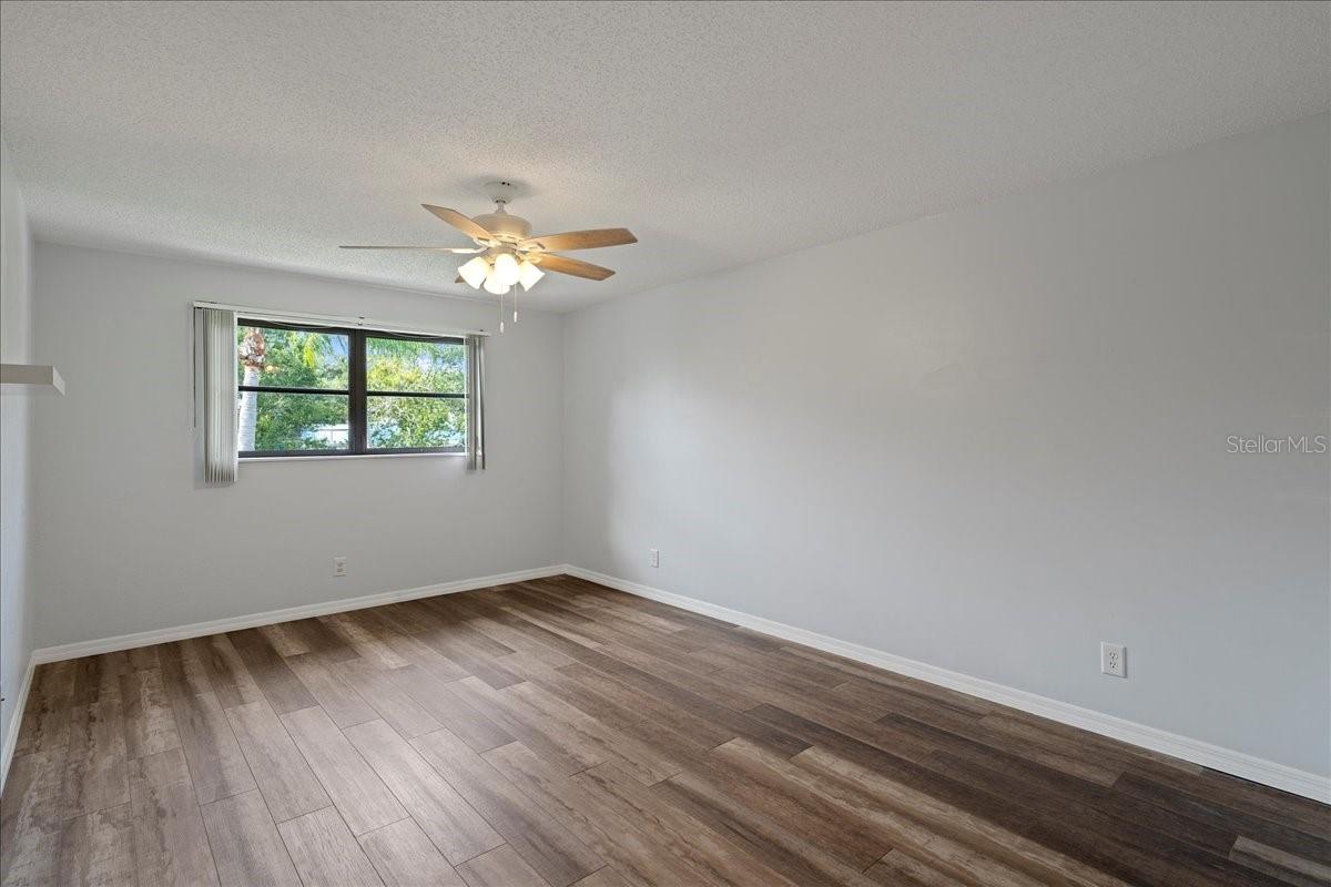 Primary bedroom with ensuite bathroom and walk-in closet