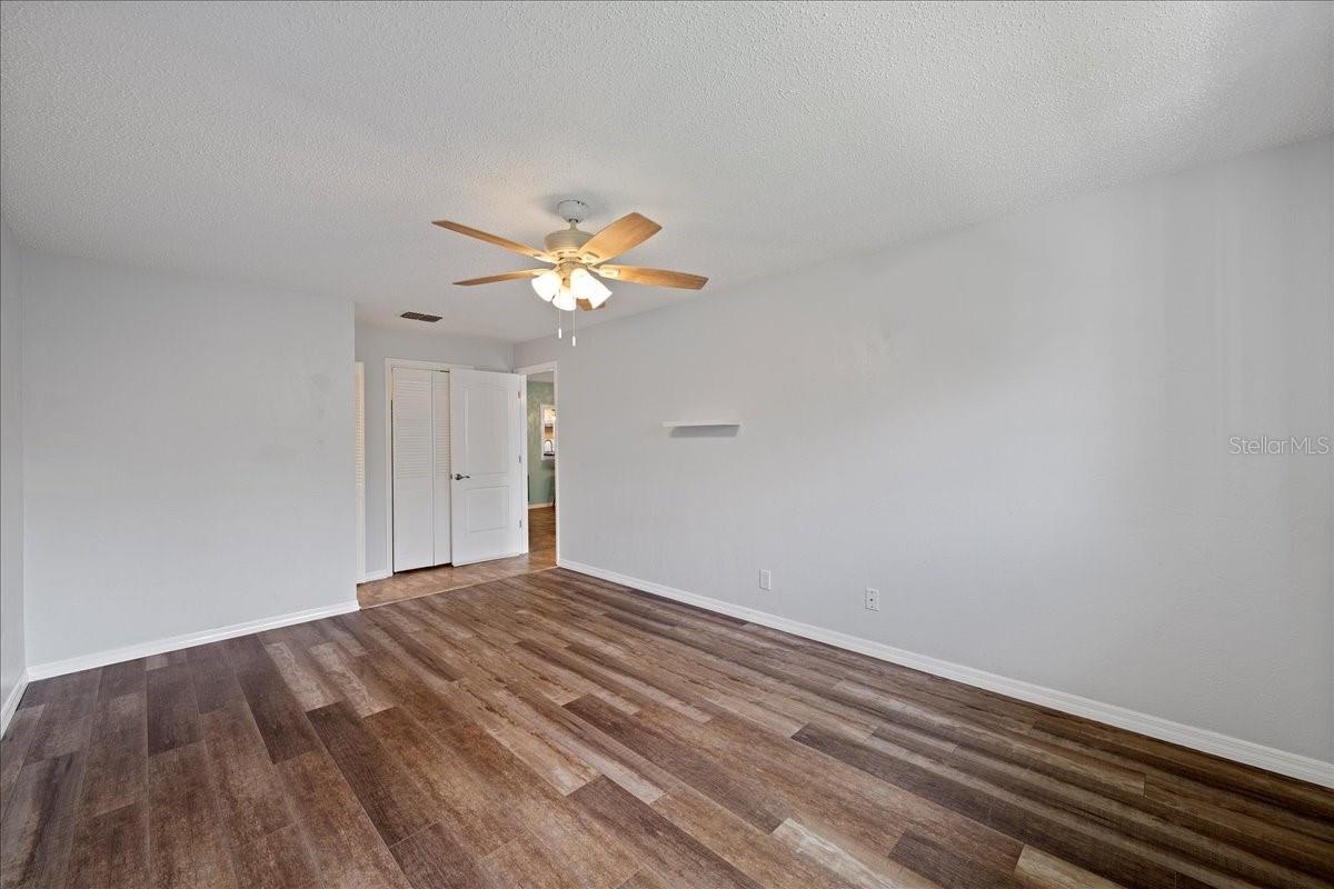 Primary bedroom with ensuite bathroom and walk-in closet