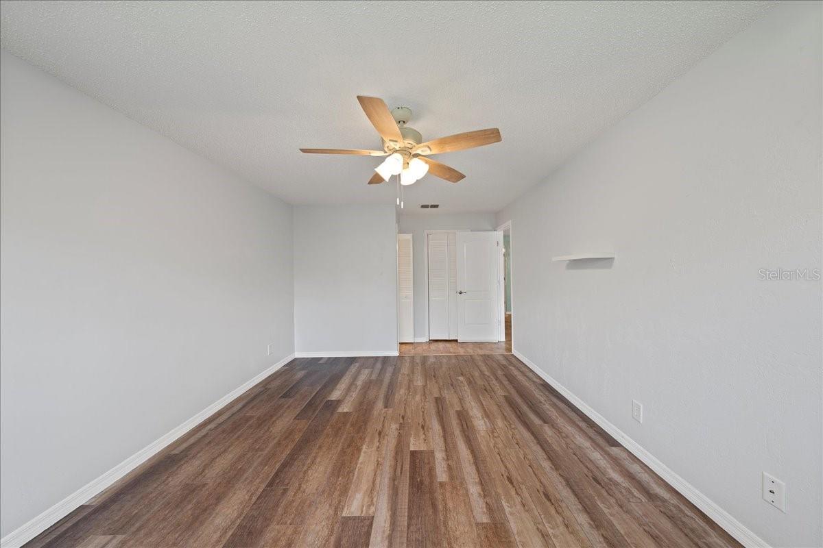 Primary bedroom with ensuite bathroom and walk-in closet
