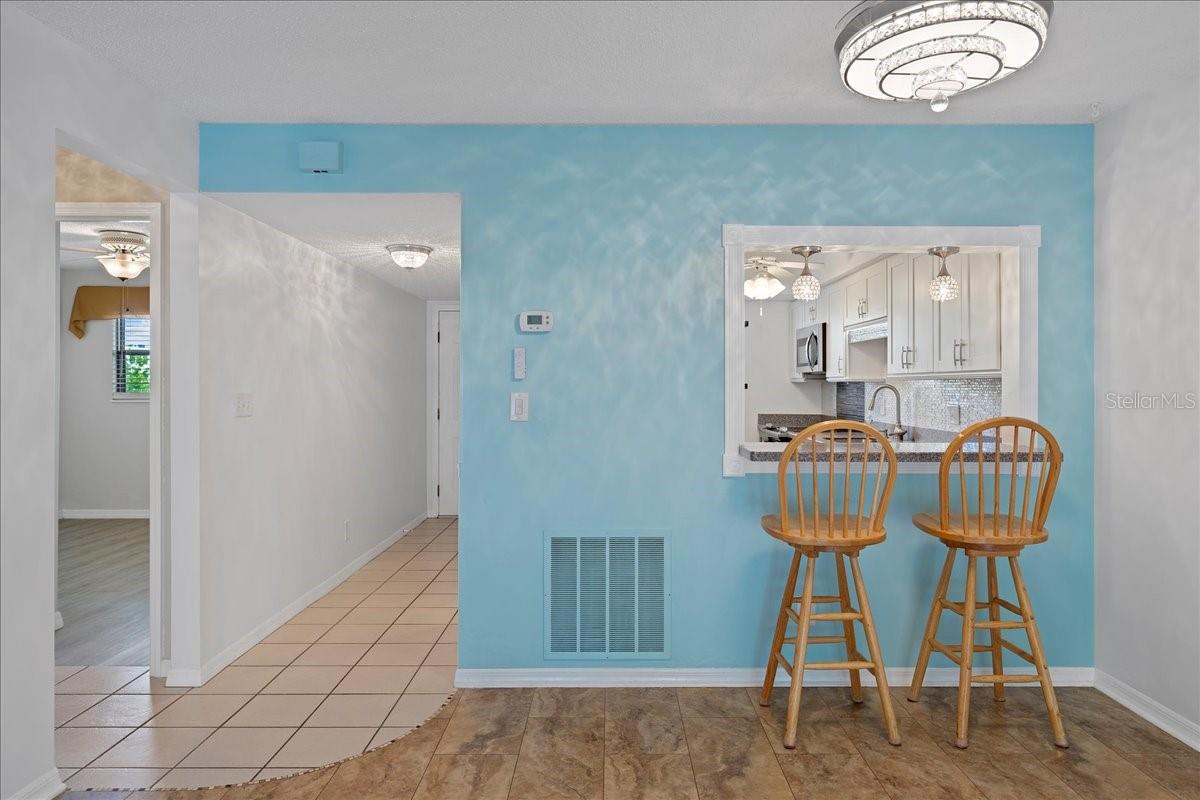 Dining room and breakfast bar pass through to the dining room perfect for serving or casual meals.