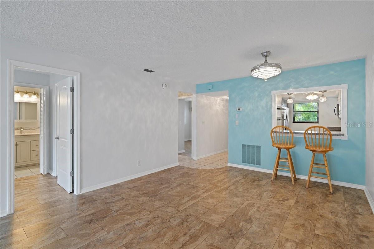 Dining room and breakfast bar pass through to the dining room perfect for serving or casual meals.