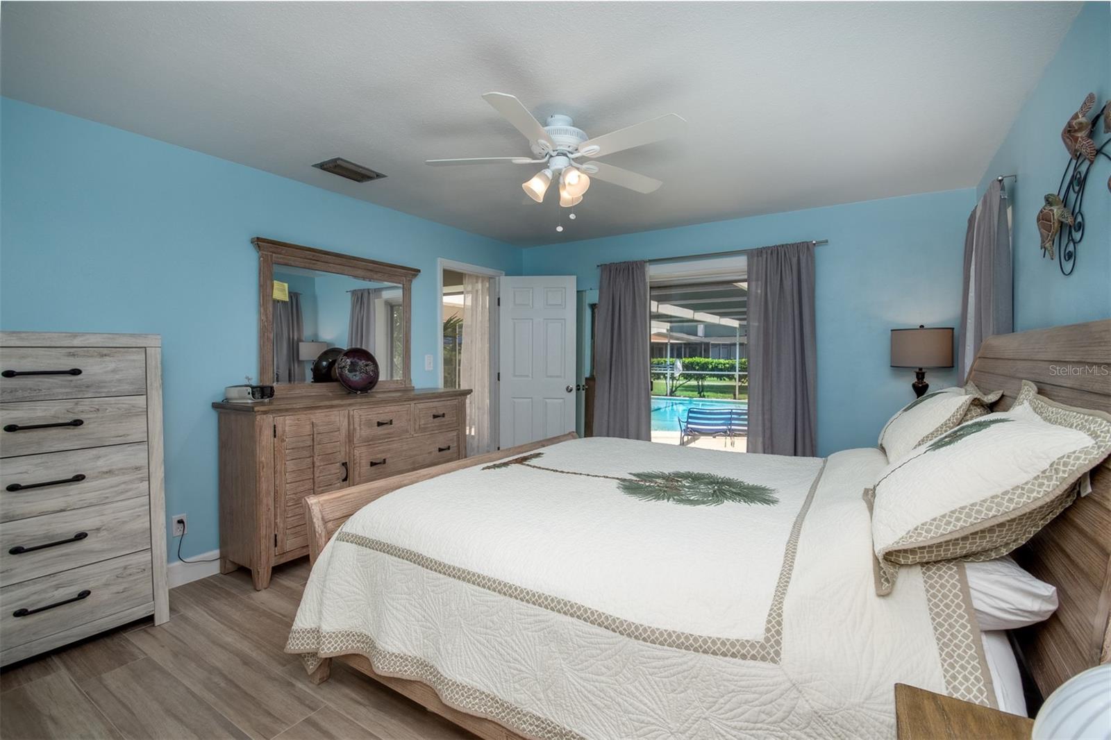 Master Bedroom with sliders leading out to the pool