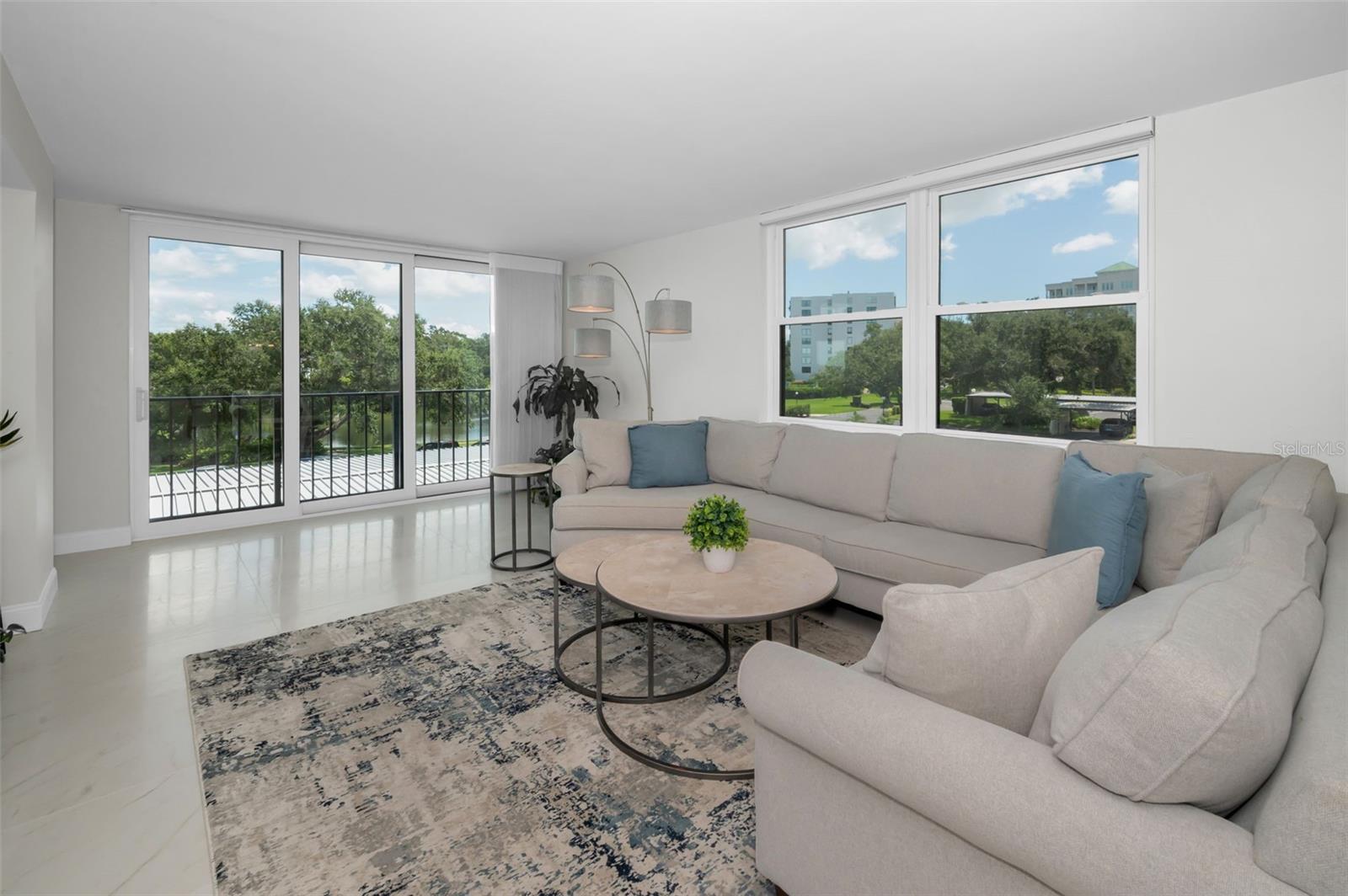 Huge Living Room with extra window offering lots of light from your new impact glass doors and window