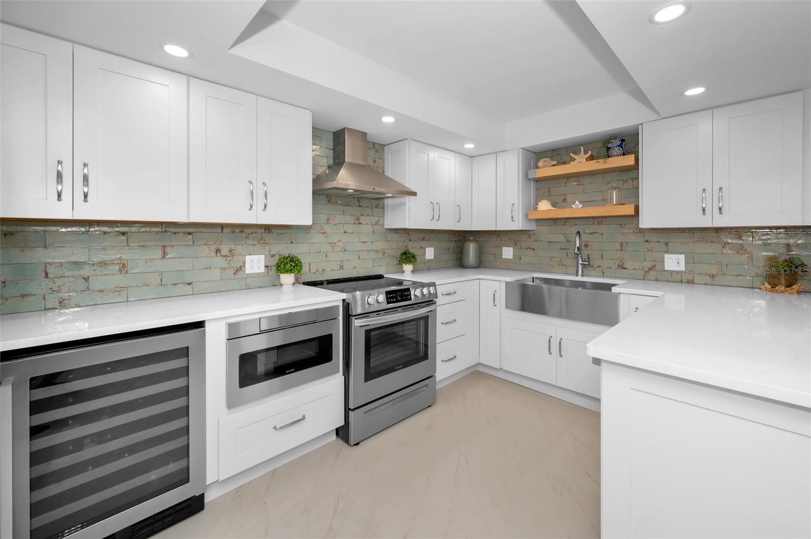 Upscale built-in wine fridge, microwave, range and range hood