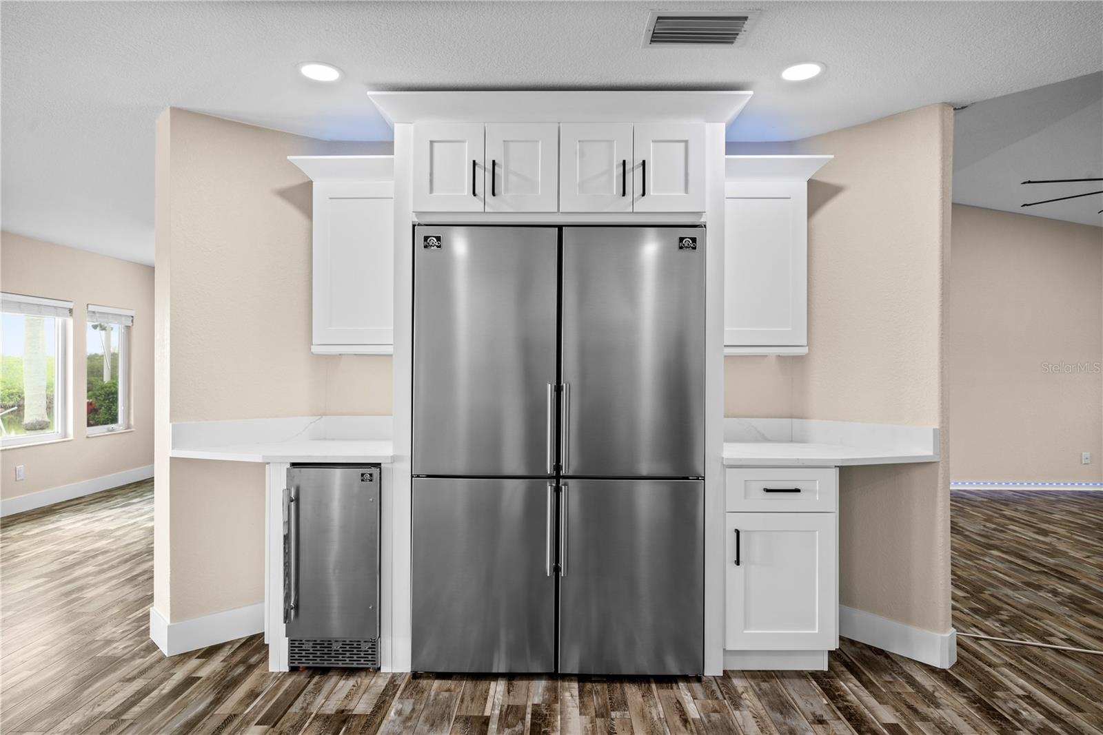Oversized fridge w/ separate ice maker.