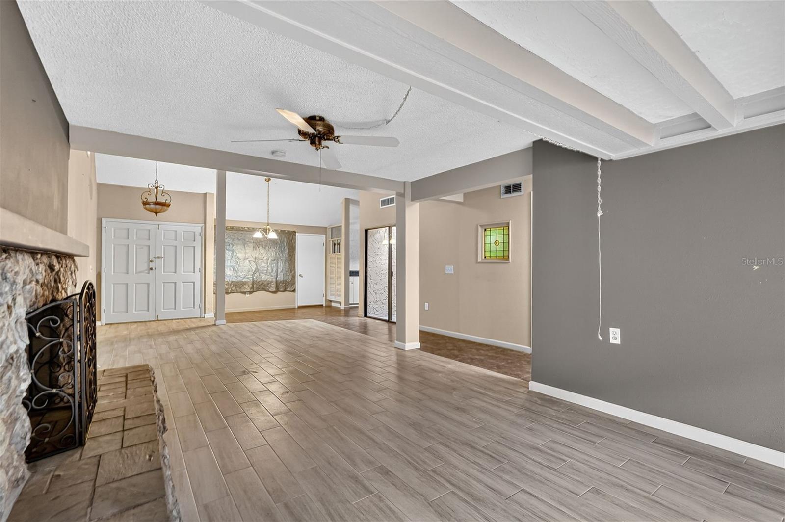 Living room looking into dining and kitchen