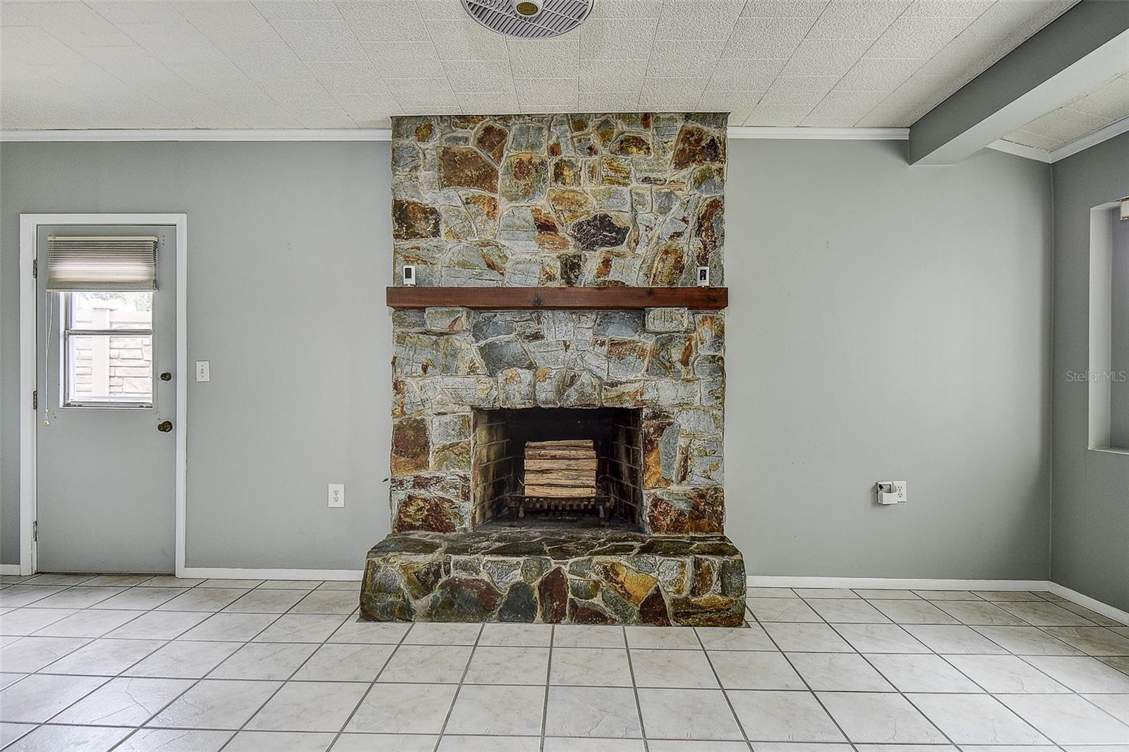 WOOD BURING FIREPLACE IS STUNNING.