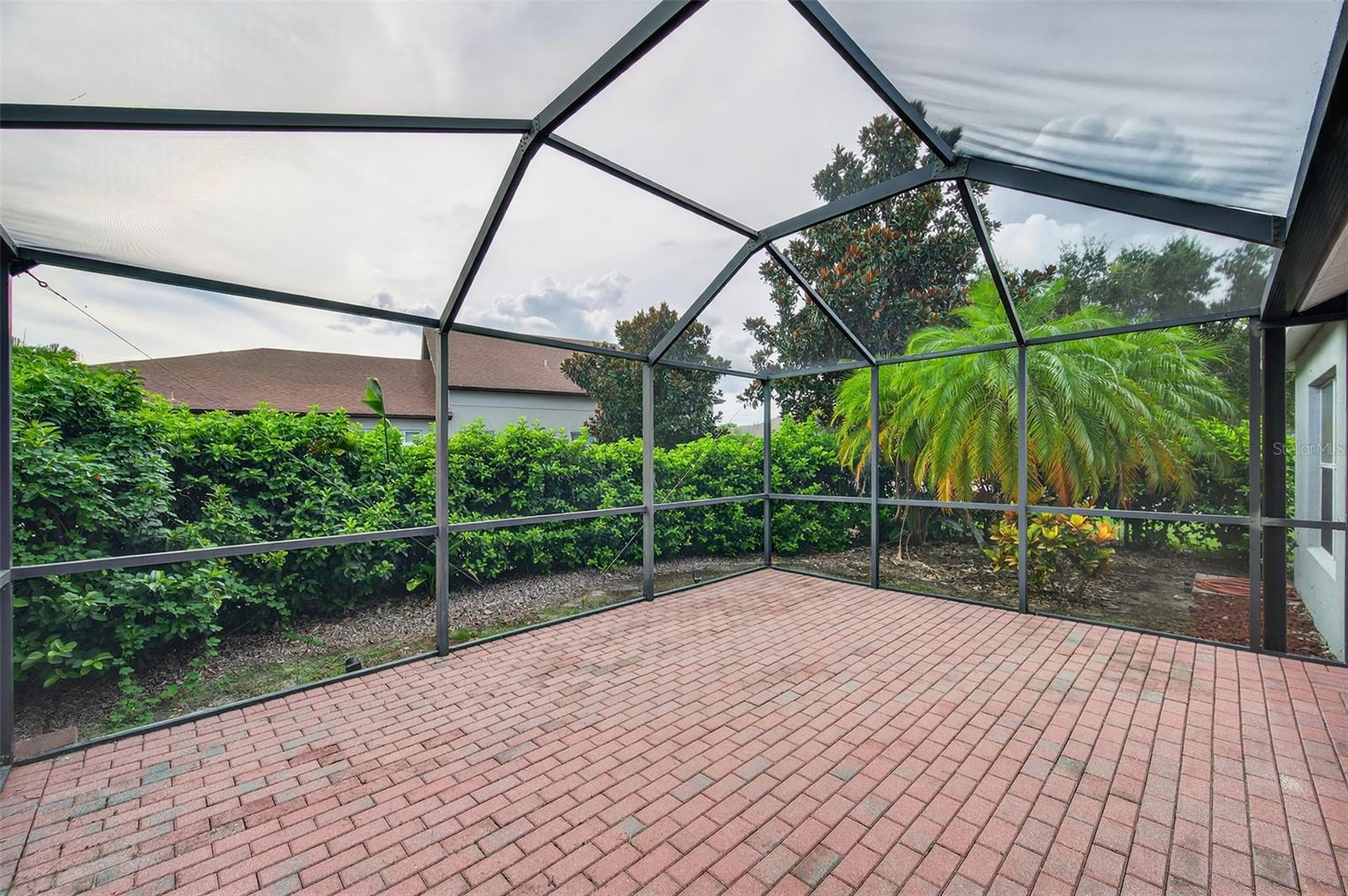 Paver Lanai with Privacy Shrubs - Before Bushes were Trimmed